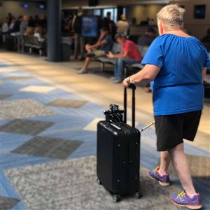 BBeep, a suitcase designed by CMU researchers, can help users with visual impairments make their way through crowds.