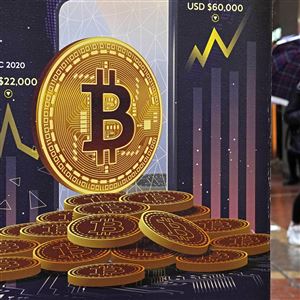 FILE - An advertisement for Bitcoin cryptocurrency is displayed on a street in Hong Kong, on Feb. 17, 2022. Bitcoin briefly hit an all-time high Tuesday, March 5, 2024, with the world's largest cryptocurrency surpassing $68,800, according to CoinMarketCap. 