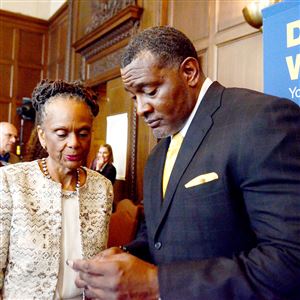 Anthony Hamlet and Superintendent Linda Lane exchange contact information on  May 18 when Mr. Hamlet was announced as the next superintendent for Pittsburgh Public Schools.