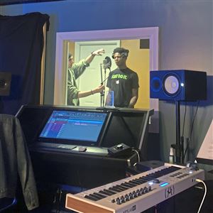 Dahnayl Champine records in the booth.  
