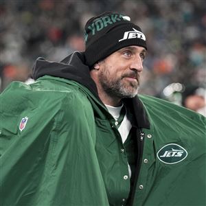 New York Jets quarterback Aaron Rodgers warms up following his 500th career regular-season touchdown pass during the first half of an NFL football game against the Miami Dolphins, Sunday, Jan. 5, 2025, in East Rutherford, N.J. 