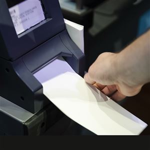 In this June 13, 2019 file photo, an investigator with the Office of the City Commissioners demonstrates the ExpressVote XL voting machine at the Reading Terminal Market in Philadelphia.