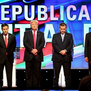 Republican presidential candidates, Sen. Marco Rubio, R-Fla, from left, Donald Trump, Sen. Ted Cruz, R-Texas, and Ohio Gov. John Kasich stand for a moment of silence for former first lady Nancy during a primary debate at the University of Miami.