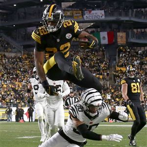 Cincinnati Bengals wide receiver Tee Higgins (85) is tackled by Pittsburgh  Steelers cornerback Cameron Sutton (20) during the first half of an NFL  football game, Sunday, Sept. 11, 2022, in Cincinnati. (AP