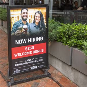 A “Now Hiring” sits outside City Works in Market Square on Monday, May 24, 2021, in Downtown.