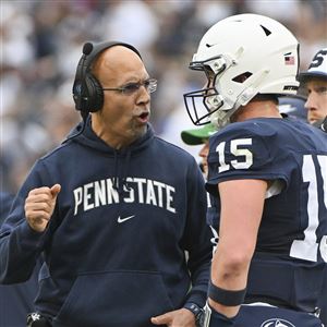 Penn State head coach James Franklin talks with quarterback Drew Allar (15) during the first half of an NCAA college football game against Indiana, Saturday, Oct. 28, 2023, in State College, Pa. 