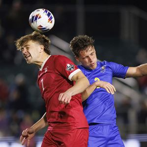 Indiana's Karsen Henderlong (7) and Pittsburgh's Jackson Gilman (2) try to head the ball during the first half of an NCAA men's soccer tournament semifinal in Cary, N.C., Friday, Dec. 9, 2022. (AP Photo/Ben McKeown)