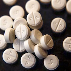 This June 17, 2019, file photo shows 5-mg pills of Oxycodone.