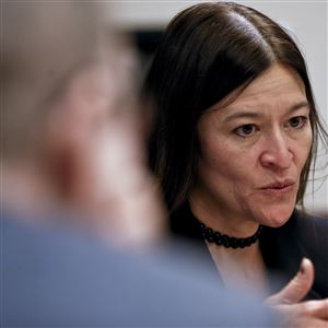 Soo C. Song, the former acting U.S. Attorney for the Western Pennsylvania district, right, discusses techniques used in a program involving opioid abuse during an interview in Pittsburgh. The Justice Department is giving federal prosecutors in 12 regions ravaged by the opioid abuse epidemic a trove of data officials say will help them stop over-prescribing doctors. 