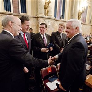 Gov. Tom Wolf, left, campaigned on scrapping the Healthy PA plan of former Gov. Tom Corbett, right, in favor of a traditional Medicaid expansion.