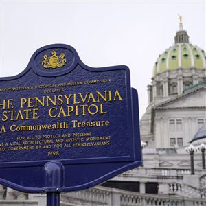 FILE - An historical marker at the Pennsylvania Capitol in Harrisburg, Pa., is seen on Feb. 21, 2023. Some of Pennsylvania’s school districts may have to empty their reserves or take out loans to ensure they can open their doors for the fall semester, with billions of dollars in state aid held up in a month-old partisan budget stalemate. (AP Photo/Matt Rourke, File)