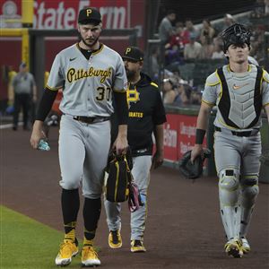 Pirates pitcher Paul Skenes, left, is seen in the first inning during a game  Wednesday, May 28, 2025, against the Arizona Diamondbacks in Phoenix.
