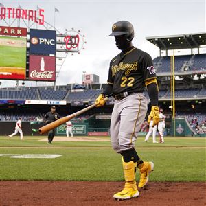 Pittsburgh Pirates' Tucupita Marcano, left, avoids the slide of