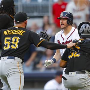 A security guard takes a ball from a little kid at the Braves-Pirates game  - NBC Sports