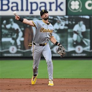 The Pirates' Jared Triolo throws to first for an out against the Cardinals in the second inning at Busch Stadium on Sept. 19, 2024 in St Louis. Triolo won the NL Gold Glove for utility players on Sunday, Nov. 3, 2024.