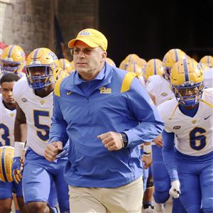 Pittsburgh head coach Pat Narduzzi leads his team onto the field at the start of an NCAA college football game against Virginia Tech, Saturday, Oct. 16, 2021, in Blacksburg, Va. 