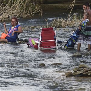 A couple bathes in the Gurabo River in the aftermath of Hurricane Maria in Las Piedras, Puerto Rico, on Oct. 2.