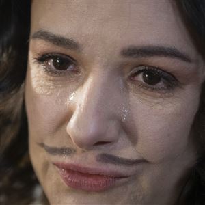 Actress Ruslana Ostapko, wearing a painted moustache, cries as the talks about her male colleagues who joined the Ukrainian army and were killed in Russia-Ukraine war, in the Chernihiv Regional Youth Theater in Chernihiv, Ukraine, Sunday, Feb. 16, 2025.