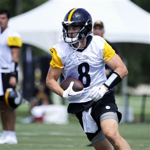 Check out Steelers LB T.J. Watt as he signs a baby at training camp