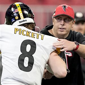 Pittsburgh Steelers quarterback Kenny Pickett (8) speaks with Atlanta Falcons head coach Arthur Smith before an NFL football game, Sunday, Dec. 4, 2022, in Atlanta.
