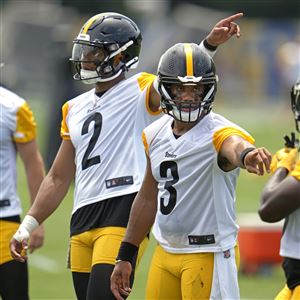 Pittsburgh Steelers quarterbacks Justin Fields (2) and Russell Wilson (3) participate in the team's NFL OTAs football practice in Pittsburgh on Tuesday, May 21, 2024.