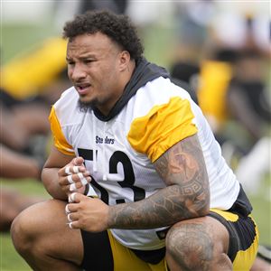 Calvin Austin III of the Pittsburgh Steelers stiff arms Keenan Isaac  News Photo - Getty Images