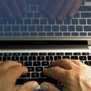 In this Feb. 27, 2013, photo, hands type on a computer keyboard in Los Angeles. 