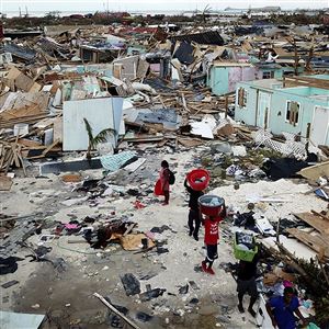 People search for salvageable items as they make their way through an area destroyed by Hurricane Dorian at Marsh Harbour in Great Abaco Island, Bahamas, on Sept. 5, 2019.