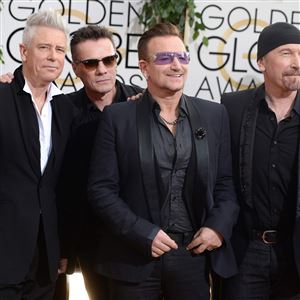U2 — Adam Clayton, Larry Mullen Jr., Bono and The Edge — arrive at the 71st annual Golden Globe Awards in California on Jan. 12. 