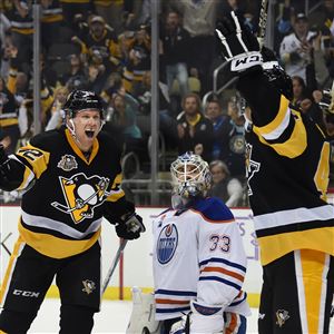 The Penguins' Patric Hornqvist, left, celebrates with Conor Sheary after he scored the game winner in the third period against the Oilers at PPG Paints Arena.