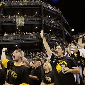 A Pittsburgh Pirates fan waves a Jolly Roger during the opening day baseball  game between the Pittsburgh Pirates and the St. Louis Cardinals at PNC Park  in Pittsburgh, Sunday, April 3, 2016.