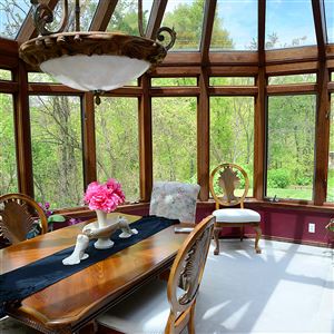 The dining room addition at 1245 Ridge Road in Harmony features lovely sunsets all year long.