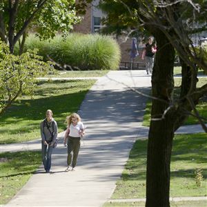 Students cross part of the campus at Geneva College.