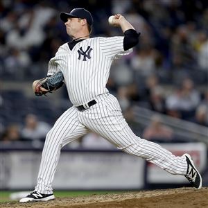 Phil Coke delivers a pitch in the seventh inning against the Kansas City Royals on May 11 at Yankee Stadium.