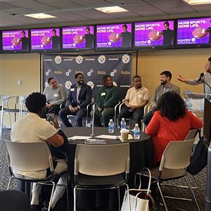 Former Steelers quarterback Charlie Batch introduces a group of accounting professionals to Woodland Hills students participating the the Steelers Showcase event at Acrisure Stadium. 