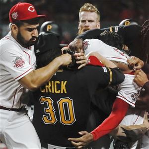 Cincinnati Reds' Yasiel Puig grabs the bat after striking out to end the  Reds half of the fifth inning of a baseball game against the Pittsburgh  Pirates, Saturday, April 6, 2019, in