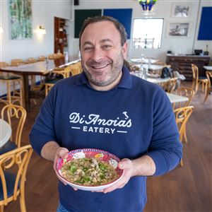 Dave Anoia, chef and owner of DiAnoia's Eatery in the Strip District, shows off his version of  beans and greens.