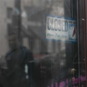 A closed sign hangs outside of a business  in Philadelphia on Friday, March 20, 2020. Businesses not classified as life-sustaining were ordered to close March 19, and though the scope of that order has been revised several times, large swaths of Pennsylvania’s economy remain shuttered.