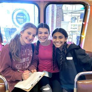 Fort Couch Middle School eighth-graders Claire Birmingham, left, Lexi Galbraith and Kiran Khurana work through the History Bowl questions at the Heinz History Center in the Strip District.