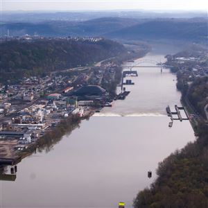 The Elizabeth Lock and Dam with the smoke stacks of the US Steel Clairton Works visible in the background Tuesday, April 11, 2017, along the Monongahela River in Allegheny County. 