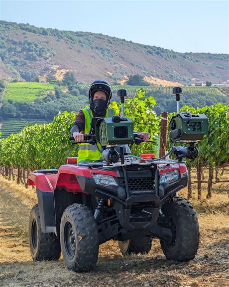 AI-powered cameras are seen mounted on an all-terrain vehicle. The system, developed by Lawrenceville-based Bloomfield Robotics, helps analyze the health of crops like grapes and blueberries.