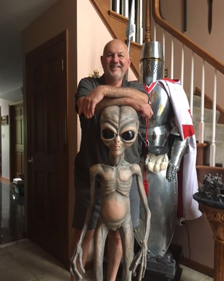 John Ventre with a couple of his buds in his Hempfield home. 