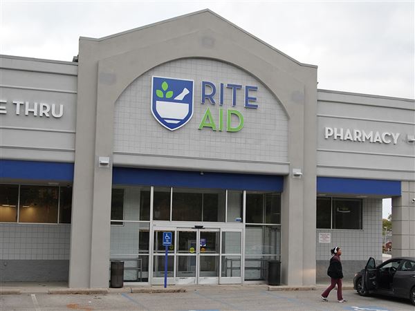 A Rite Aid customer leaves after realizing the Rite Aid in Baldwin along Curry Hollow Road is no longer open on Oct. 18.