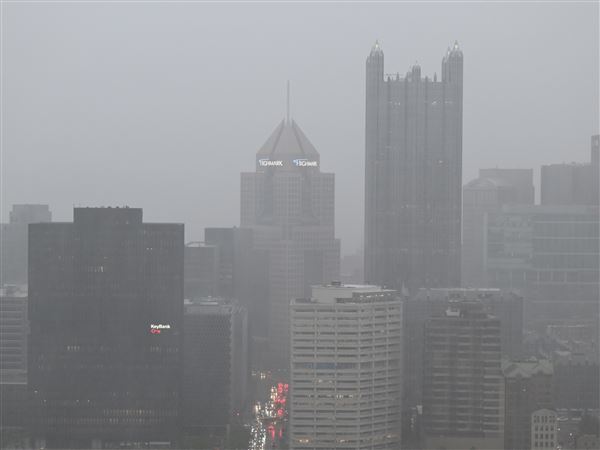 Rain blankets Downtown on Tuesday, April 29, 2025.  