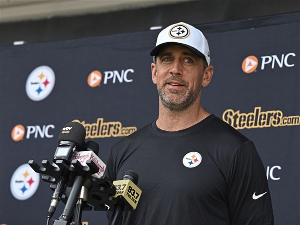 New Steelers quarterback Aaron Rodgers (8) speaks to media after his first practice at Steelers Minicamp at the UPMC Rooney Sports Complex on the South Side on Tuesday, June 10, 2025.   