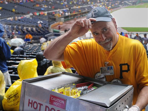 Hot dog vendor works the Field Box crowd at Shea Stadium, …