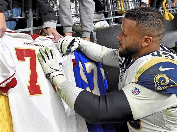 Los Angeles Rams' Aaron Donald wears the team's new jersey at SoFi