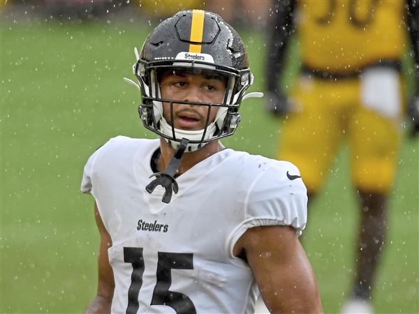 Pittsburgh Steelers' Cody White (15) is hit after making a catch