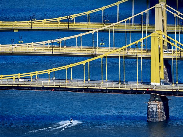 The Roberto Clemente Bridge, one of the Sister Bridges crossing over the Allegheny River, is seen in the foreground. The other sister bridges are the Andy Warhol Bridge, center, and the Rachel Carson Bridge, rear. They have been nominated for historic designation.