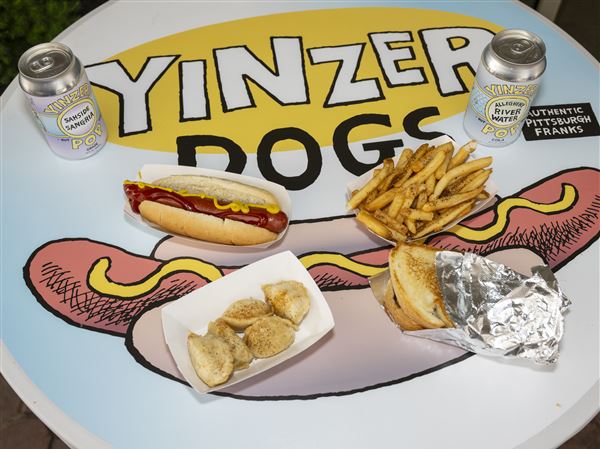 Yinzer Dogs signature hot dog, Yinzer Bites (pierogies), fries and grilled kielbasa.